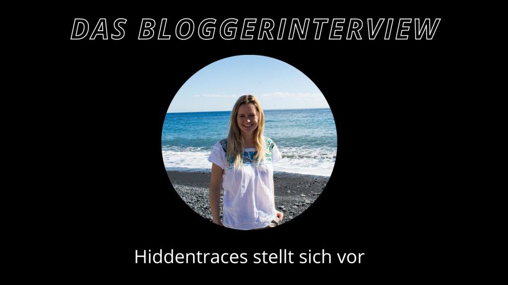 eine frau mit weißer bluse vor dem meer